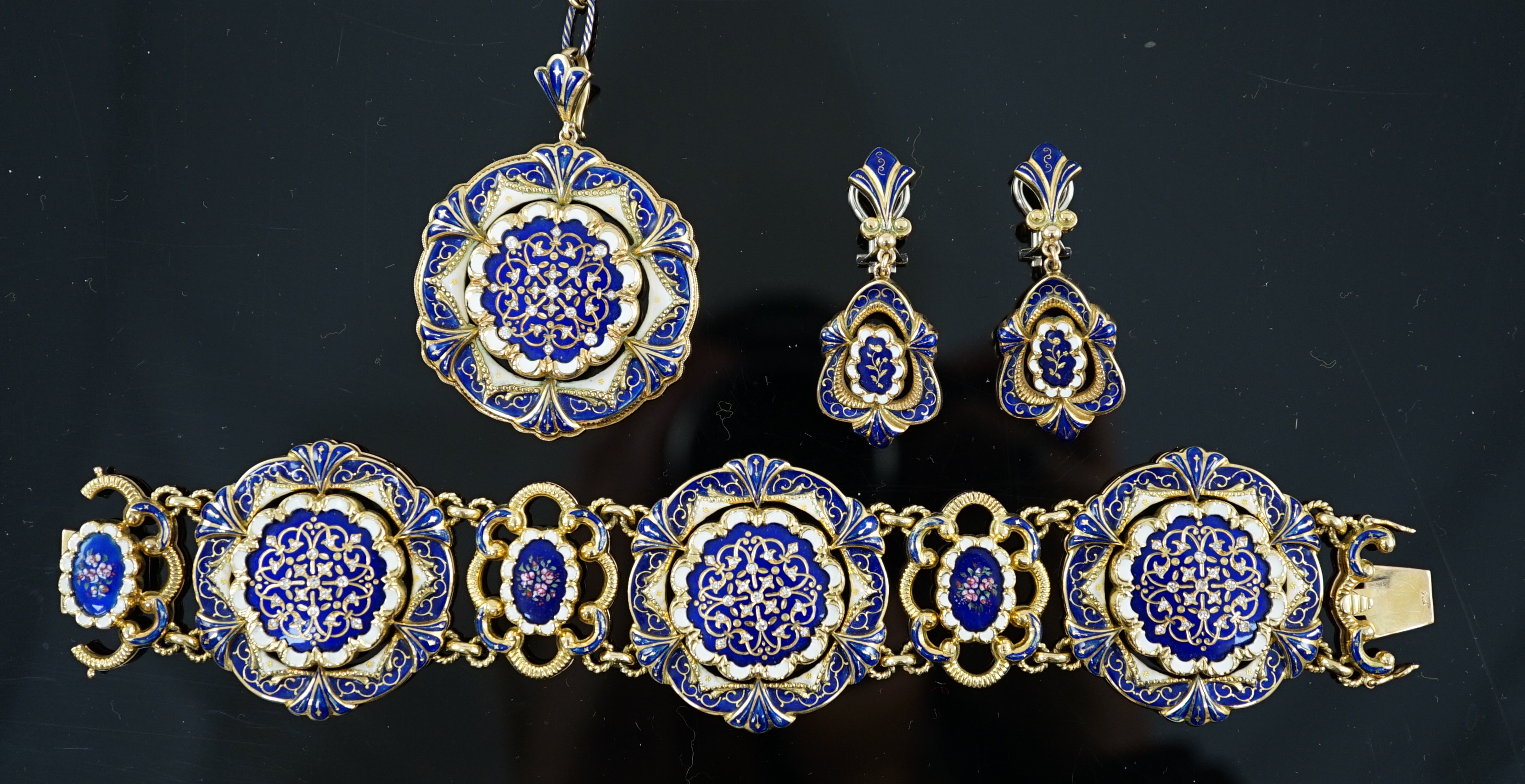 A late 19th century Swiss 18ct gold and polychrome enamelled suite of jewellery, retailed by E. Meister, Zurich